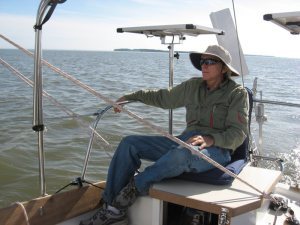 The author, James Baldwin, at the helm of refit ATOM