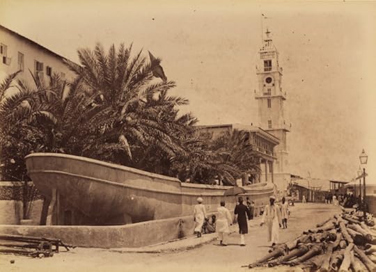 Boat-Cistern, built alongside of the Beit al-Sahel, in Zanzibar Stone Town  Water Trough in Shape of Boat / Lighthouse in Background Photographer unknown Albumen print Zanzibar, c. 1880-1900  73-23 Courtesy the Melville J. Herskovits Library of African Studies Winterton Collection, Northwestern University
