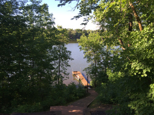 What is at the bottom of this lake? What object is at the bottom of this lake? What childhood memories does your character have from visiting this lake? There has been an accident here. How does it affect the POV character and community? What do people remember about the accident? There is a cabin that the POV character passes and imagines was a place they lived. What does this cabin look like? Why is it so appealing to the POV character? What life do they wish they had that the cabin symbolizes? 