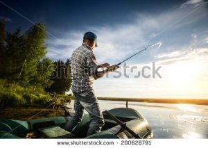 stock-photo-mature-man-fishing-from-the-boat-on-the-pond-at-sunset-200628791