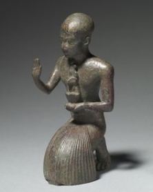 A priest making a ritual gesture...part of Doing Things, probably offering