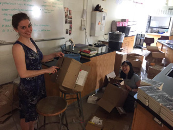 Jess Keating and Debbie Ohi breaking down boxes