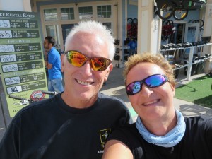 a couple smiling into the camera