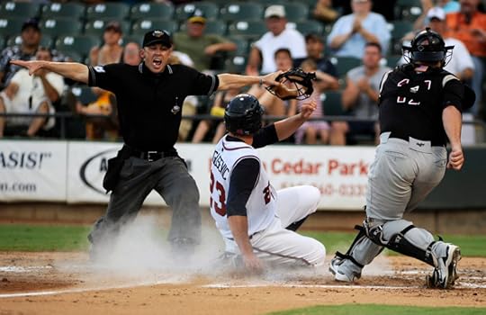 (8/10/2010) – James Brosher/AMERICAN-STATESMAN – Home base umpire Mike Lusky signals safe as Express first baseman Brian Bogusevic (23) slides into home plate, scoring Round Rock's first run in a game against Sacramento at Dell Diamond on Tuesday, Aug. 10, 2010. 0811express