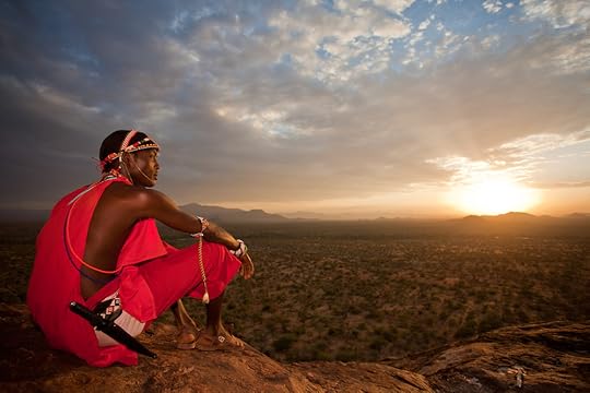 A Samburu Moran surveys a vast landscape unscarred by industrial development in northern Kenya (Robin Moore)