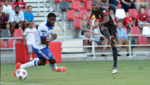 Scorpion Omar Cummings unleashes a shot as Eddie Kareem Moses tries to recover. PHOTO: NASL