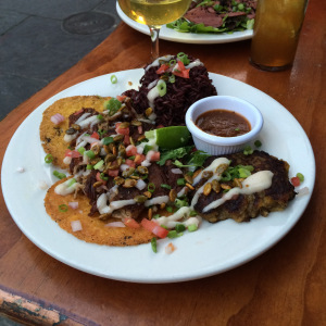 Berkshire pork with plantain cakes and purple rice