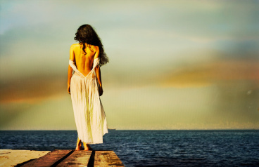 lonely-girl-looking-out-to-sea