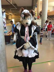 Quaint yet creepy mouse person in frock.
