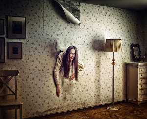 angry woman climbs through the wall into the room (photo and hand-drawing elements compilation. texture and grain add)