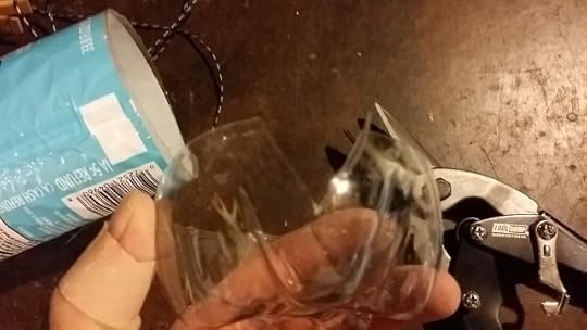 Use scissors or snips or a razor blade to remove triangles from the base of the bottle
