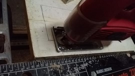 Use jigsaw to cut rectangle from plastic