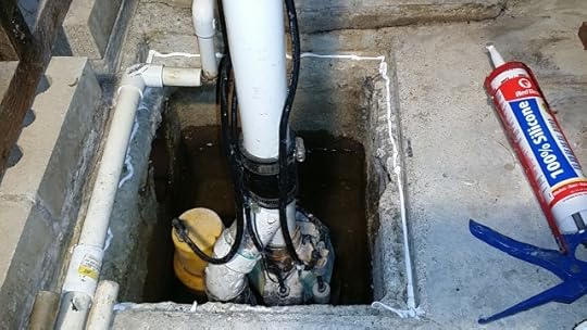 Apply a bead of caulk to perimeter of sump hole