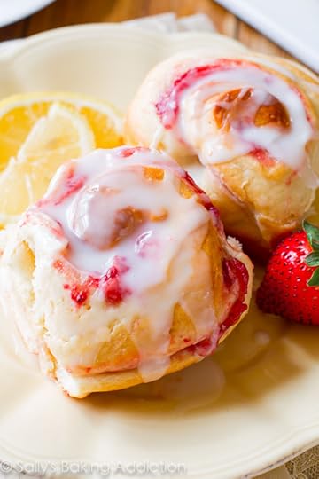 Make-ahead soft & fluffy strawberry rolls with sweet lemon glaze! Grab the recipe on sallysbakingaddiction.com