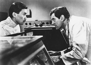 Burt Kwouk left in Curse of the Fly