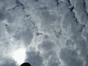 Sun shines through storm clouds.
