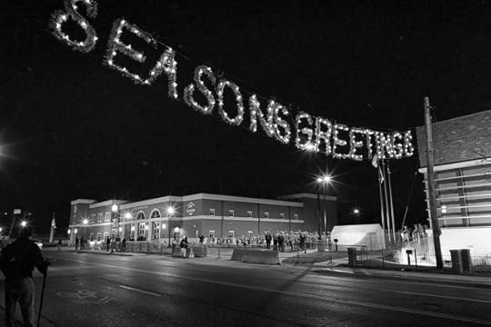 Ferguson protest underneath Seasons Greetings lights