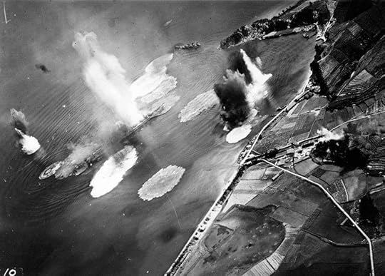 Japanese cruiser Tone under air attack near Kure, Japan, 24 Jul 1945; photo taken by USS Shangri-La aircraft. (US National Archives)