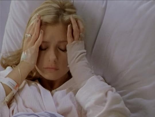 Buffy, with four rings on her fingers.