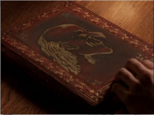 The cover of the book, with the exact monster they're looking for painted on it.