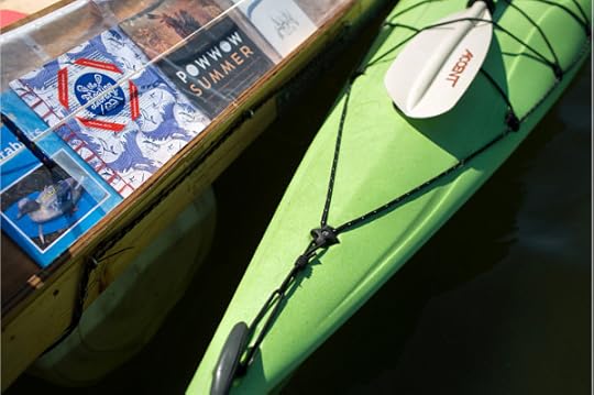 Artist-made books enclosed in plastic bags line the shelves of the Floating Library. Jennifer Simonson | MPR News