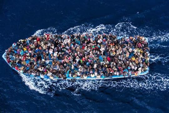 Refugees from North Africa heading for Italy. Photograph by Massimo Sestini.