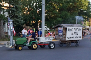 Shouldn't every parade have a float featuring a robot, kids in a cast iron bathtub, and a shack with a working chimney?