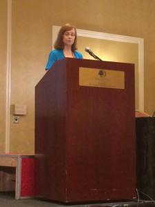 Speaking to the bookstore owners on Tuesday (notice the riser to help me see over the podium) Photo courtesy Megan Marley