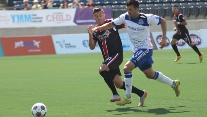 Ottawa's Sinisa Ubiparipovic, left, challenges FCE's Thiago de Freitas. PHOTO: FC EDMONTON