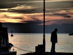 Lonely man on pier