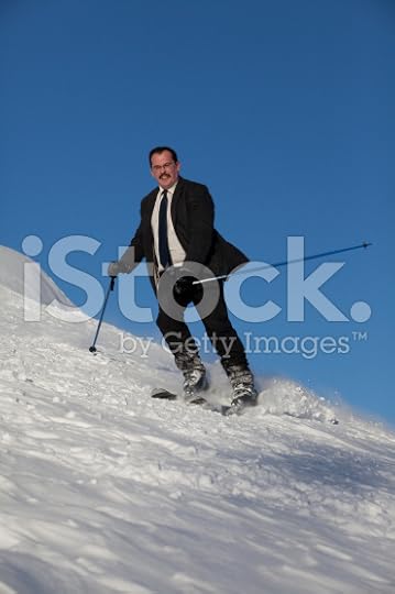 stock-photo-15630643-man-in-business-sute-on-ski