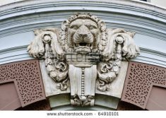 stock-photo-lion-head-detail-of-antique-sculpture-from-grand-palace-thailand-64910101
