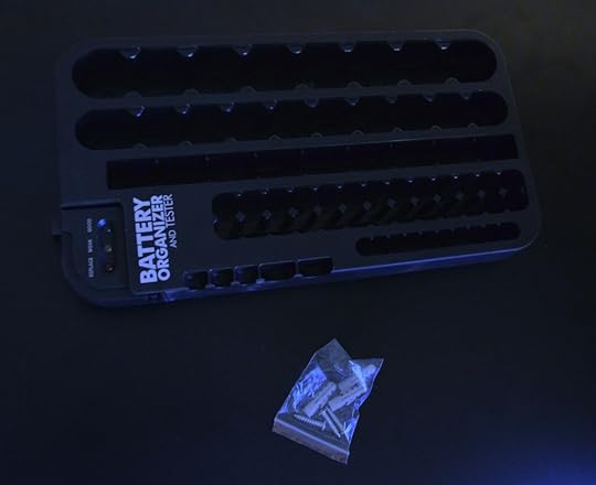 Inside the box is the battery holder with removable tester, as well as wall mounting hardware.