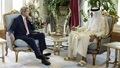 Qatar's Emir Sheikh Tamim bin Hamad al-Thani (R) talks with U.S. Secretary of State John Kerry before their meeting at the Diwan Palace in Doha, August 3, 2015.