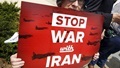 An activist holds a banner during an event of delivering more than 400,000 petition signatures to Capitol Hill in support of the Iran nuclear deal in Washington July 29, 2015.