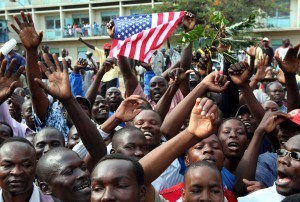 Kenyans wave US flag as they welcome US Senator Obama in Kisumu