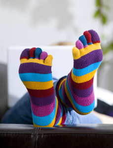 woman lying at home with laptop