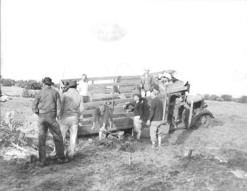 Students from Arendtsville Vocational High School had to dig their truck out of mud during their trip to Alaska in 1937.