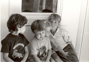 Jake, Max, Lisa and Sara when they were really young, sitting on Grandma Clark's front steps