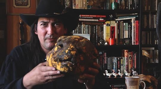 Richard Stanley, holding the Dog Man mask he used to sneak his way onto the set of The Island of Dr Moreau after he was fired