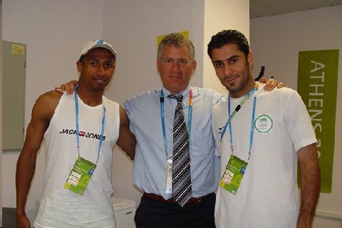 Dr. Mandelbaum with two Iraqi soccer players at the 2000 Olympics