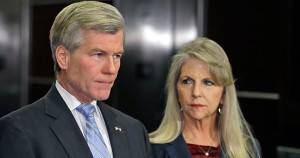 Former Virginia Gov. Bob McDonnell makes a statement as his wife, Maureen, listens during a news conference in Richmond, Va.,<br /> Tuesday, Jan. 21, 2014. McDonnell and his wife were indicted Tuesday on corruption charges after a monthslong federal investigation into gifts the Republican received from a political donor. (AP Photo/Steve Helber)