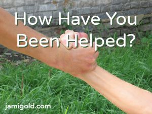 Hands grasping to help with text: How Have You Been Helped?