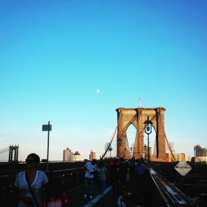 Moon rising over the Brooklyn Bridge