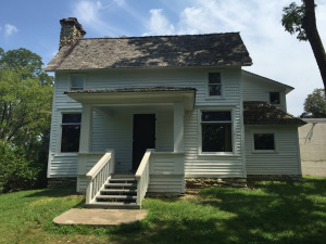 Here's the outside of the Rocky Ridge Farmhouse. It hasn't been changed since Laura's death. Almanzo's stash of medications from the late 1940s still sit on the table next to his bed. There's a jar of Vicks Vapor Rub. 