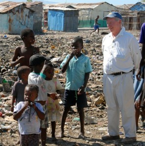 Father Tom and children in Cite Soleil image from Hands Together website