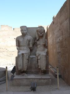 Statue of Tutankhamun and Ankhesenamun at Luxor, hacked at during the damnatio memoriae campaign against the Amarna line of Thutmoside pharaohs. copyright Wikipedia