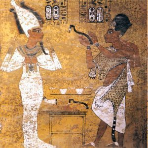 Ay performing the opening of the mouth ceremony for Tutankhamun, scene from Tutankhamun's tomb. Copyright Wikipedia