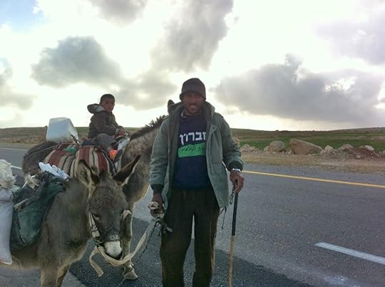 Palestinian man with his son and donkey