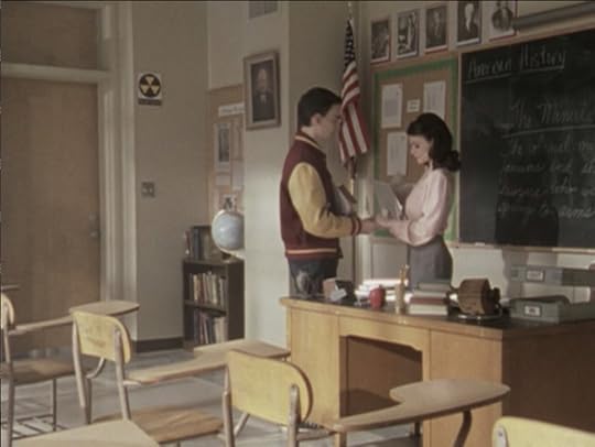 The teacher and her male student holding hands
